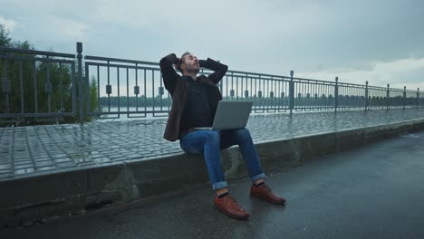 stressed businessman on a rainy day