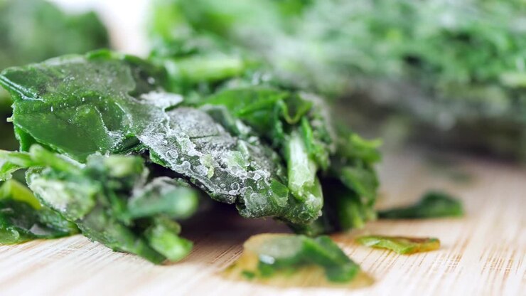 Close up of frozen spinach on cutting board