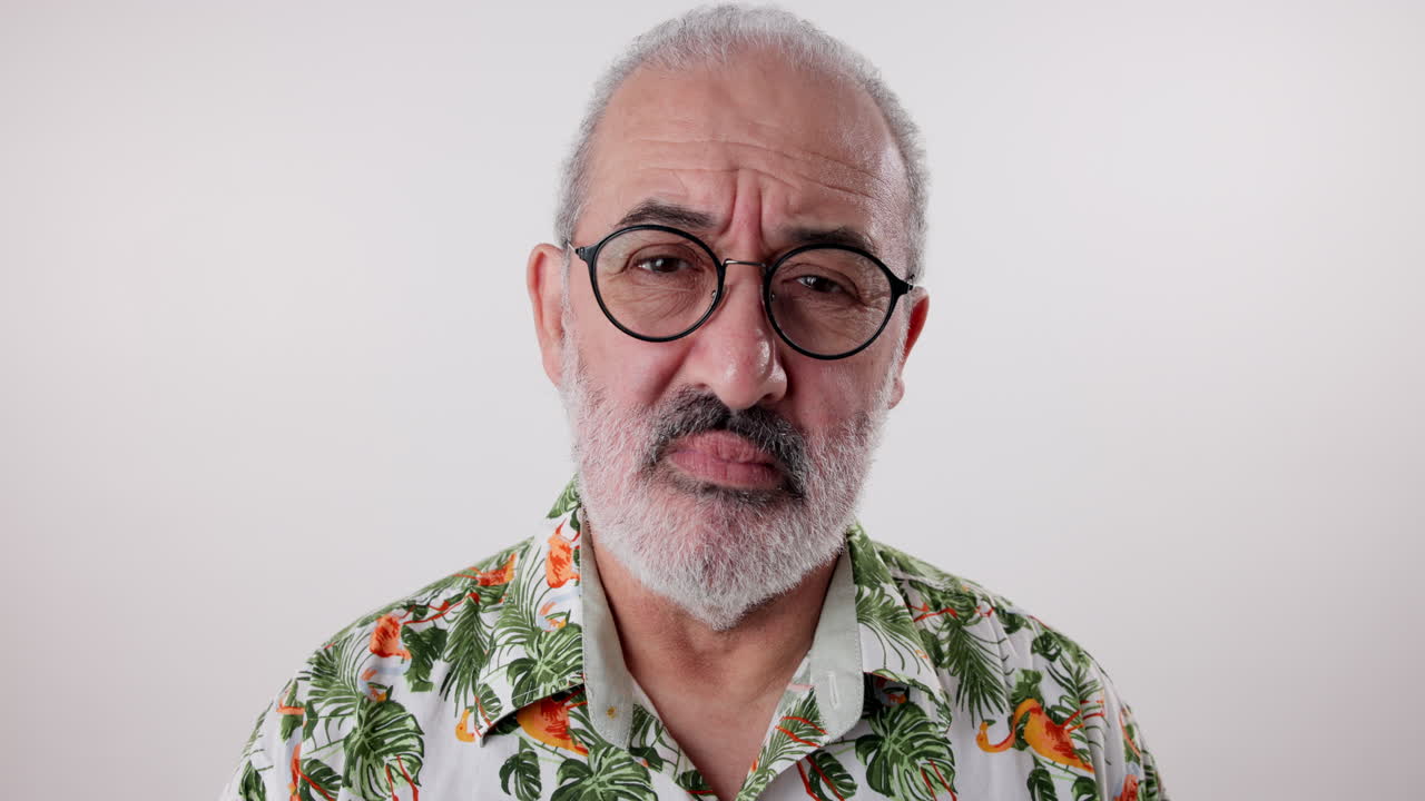 Portrait of a man with gray hair and glasses