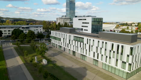 aerial backwards flight over modern oliwa campus of university in gdansk,poland