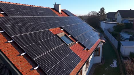 pv systems - solar panels on the roof of a house - drone shot