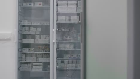 real genuine pharmacy cabinet with medicines and drugs tablets, vitamin boxes, pills, supplements