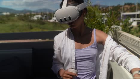 woman experiencing virtual reality headset outdoors