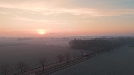 frozen sunrise over dutch farmland