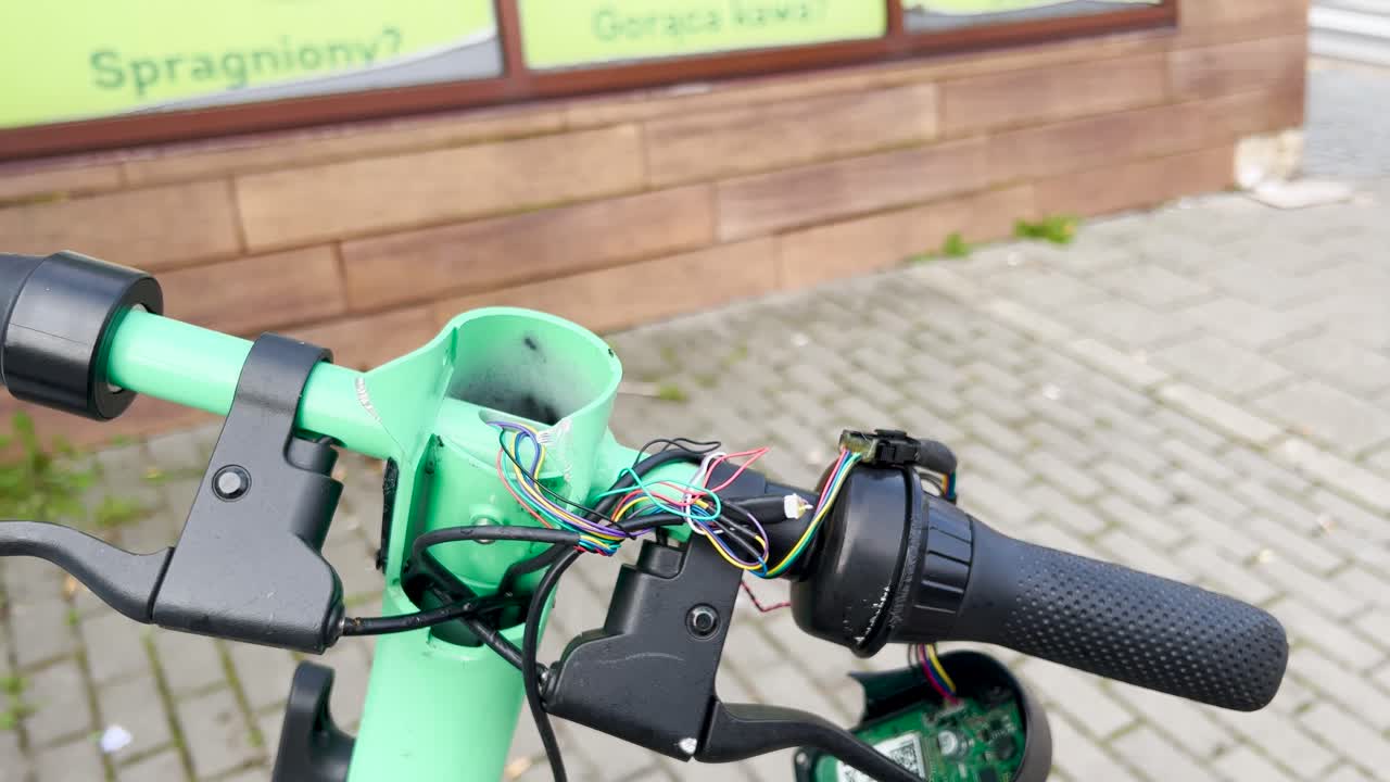 Close Up View Of Broken E Scooter Handle Left On Street Outside