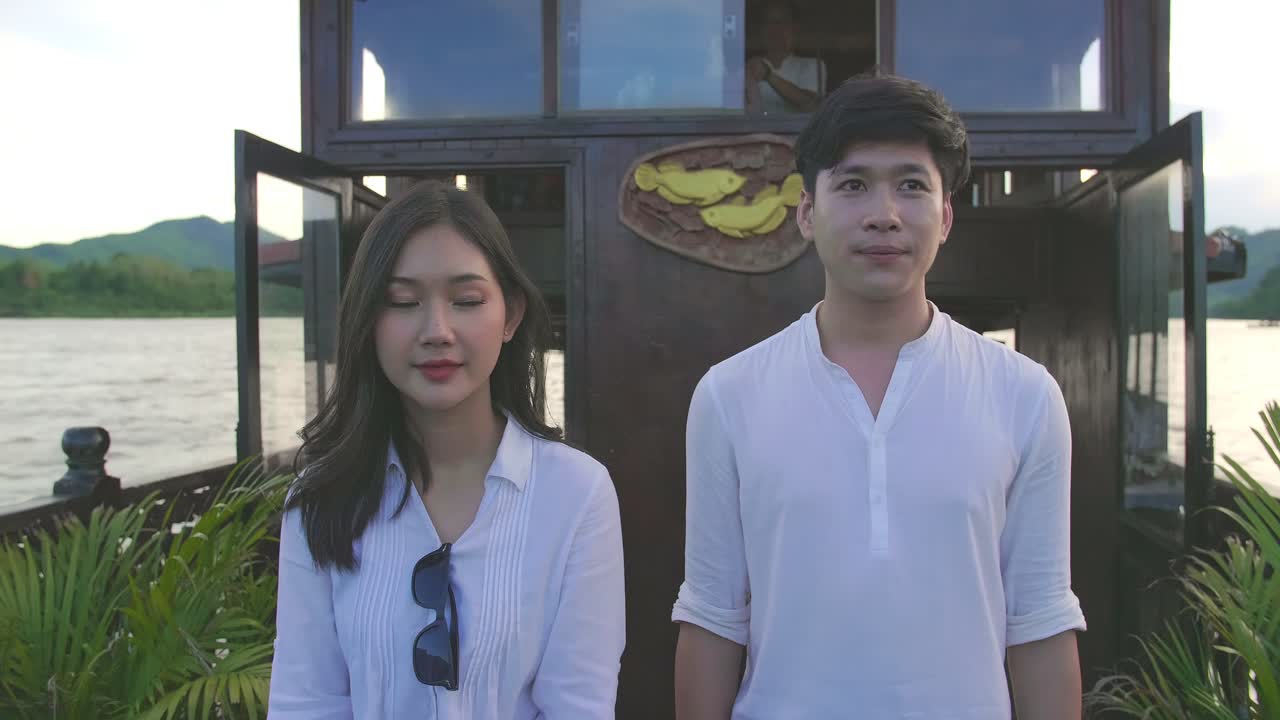 Asian Couple Walking On The Small Boat, Video In 4K