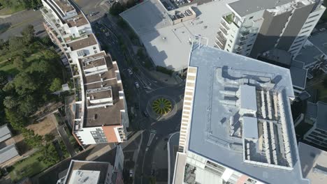 Aerial-drone-shot-of-Apartment-Buildings,-main-road-and-roundabout