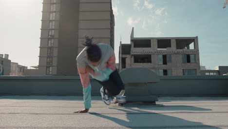 dancing-man-breakdancing-on-roof-top-hip-hop-dancer-practicing-dance-routine-performing-freestyle-moves-in-city