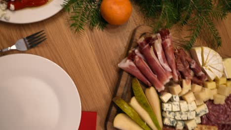 christmas dinner table setting with appetizers