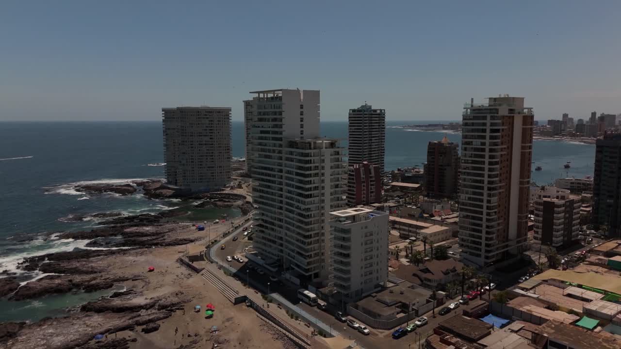 Iquique playa brava chile tarapaca cavancha day beach city buildings