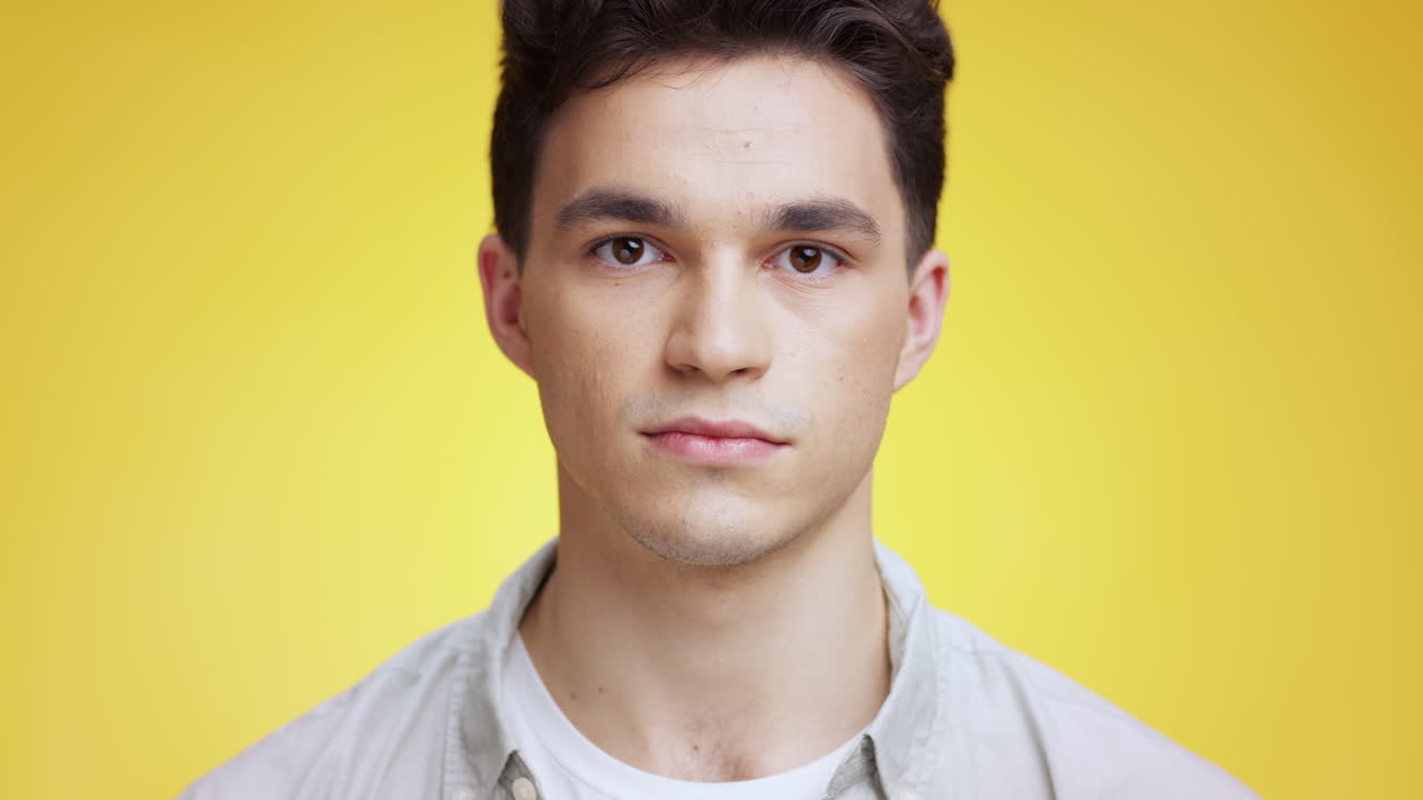 Man with hands on face, expressing shock and surprise