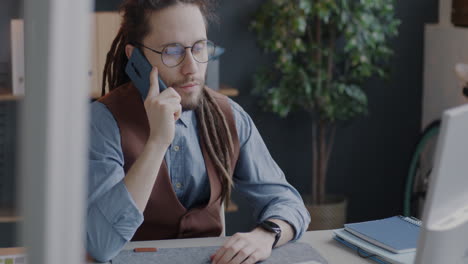 Man Talking on Smartphone in Office
