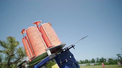 slow motion clay pigeon from the side. bench shooting on plates. v-log bench shooting on plates. automatic machine for throwing plates for shooting. throwing machine for bench shooting.