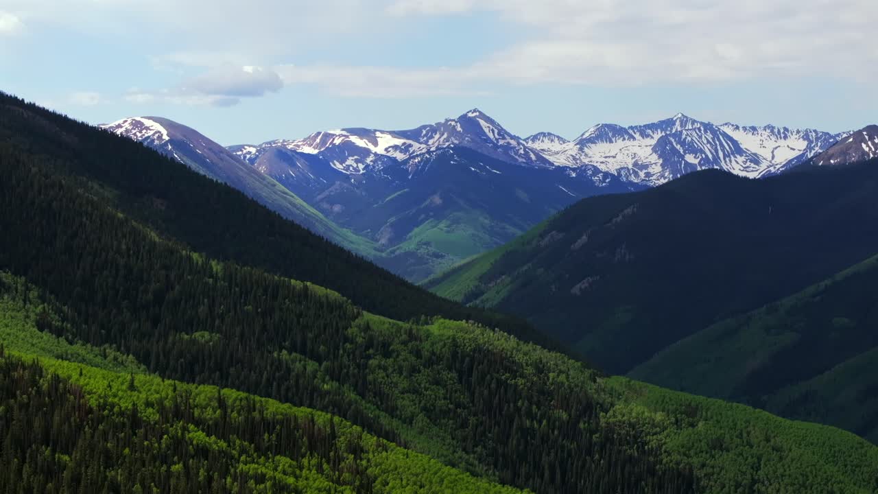 Ashcroft Mountain ghost town spring summertime morning blue sky clouds Aspen Mountain Ajax Little Annie Trailhead aerial drone Colorado scenic Rocky Mountains Elk Range Aspen Trees backwards pan up
