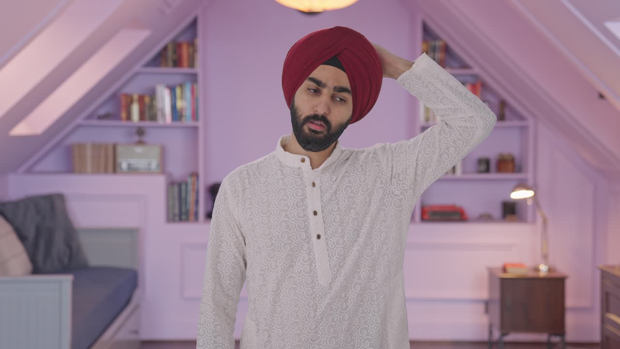 Confused Sikh Indian man thinking