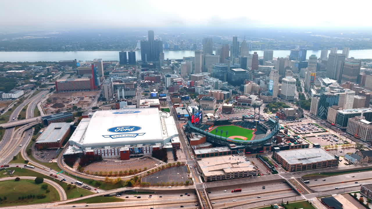 Detroit, USA, 28 July 2025: Foggy Aerial View of Detroit Riverfront and Sports Stadiums. A striking aerial view captures the downtown Detroit