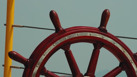 the ship's rudder is red. zoom out shot