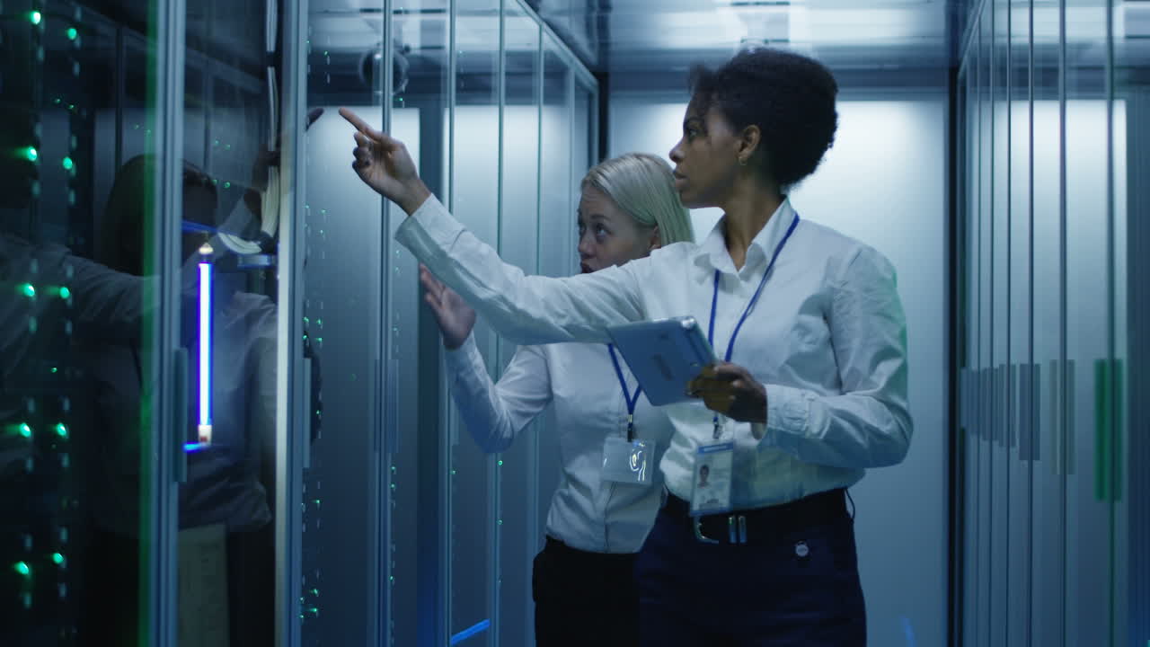 IT Staff Monitoring Servers in a Data Center