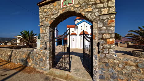 coastal white mediterranean traditional church pov at kissamos port greece, summer travel destination