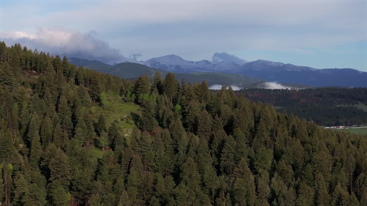 Foggy Front Range Rocky Mountains Mount Blue Sky Evans foothills valley of Evergreen Colorado aerial drone summer spring Marshdale Conifer Bailey Arapaho National Forest morning clouds upwards