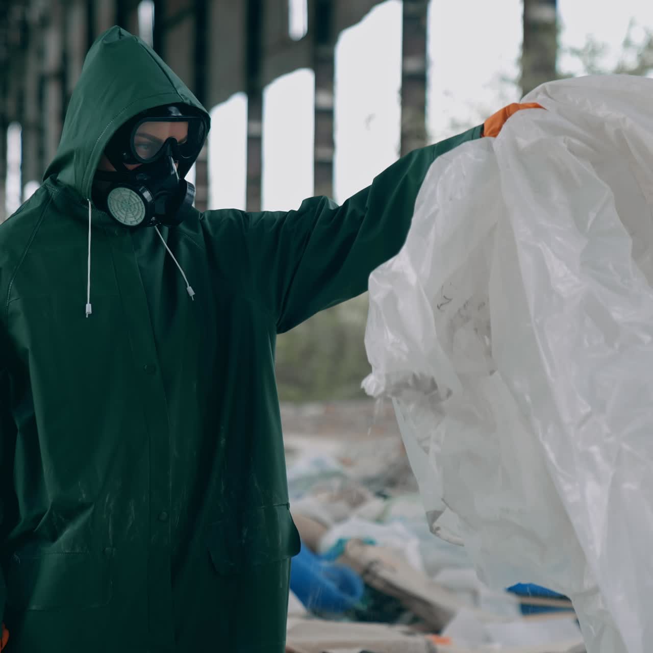 Apocalyptic concept architecture. Man in radioactive suit in abandoned city