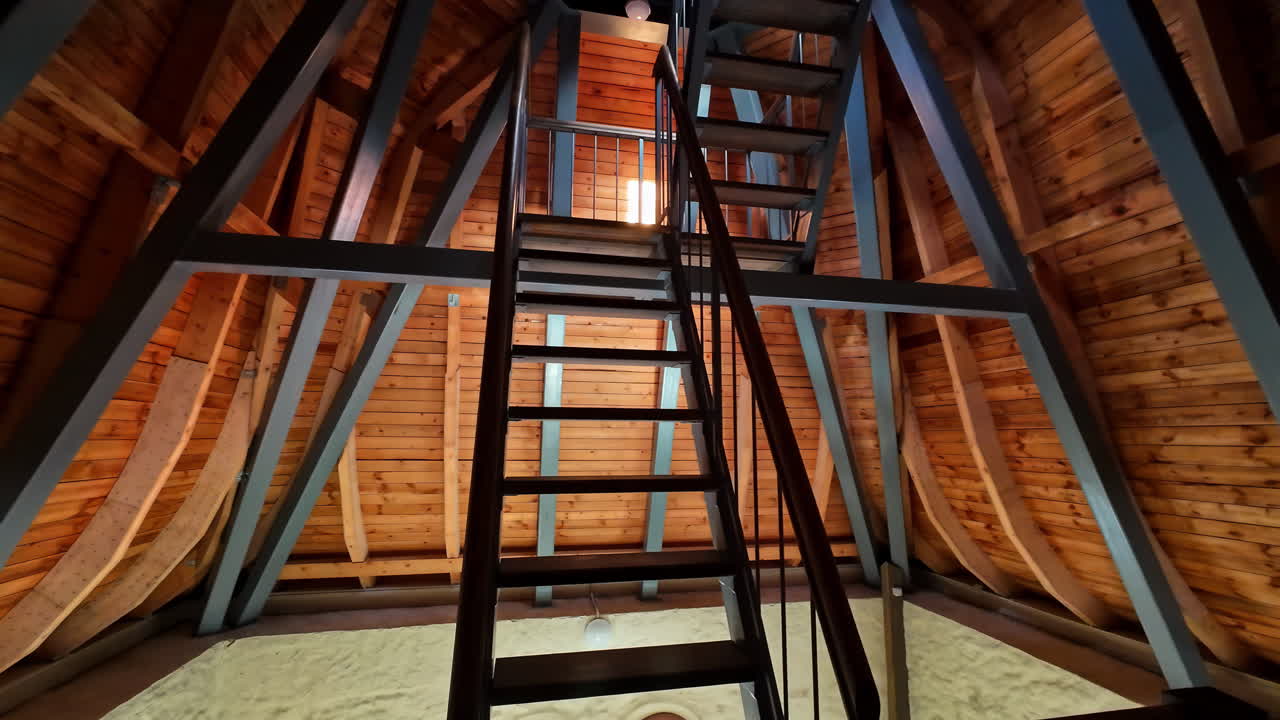 Interior of a wooden cabin with stairs
