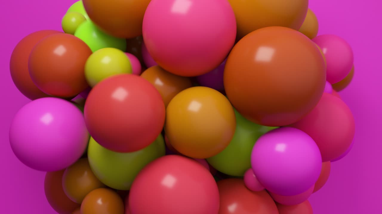 Cluster of colorful spheres on a magenta background
