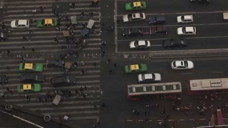 a view looking straight down at a street from atop a high building 1