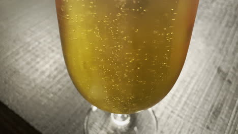 Macro-close-up-of-bubbles-in-beer-Rising-In-Freshly-Poured-Glass-Of-Golden-Light-Beer