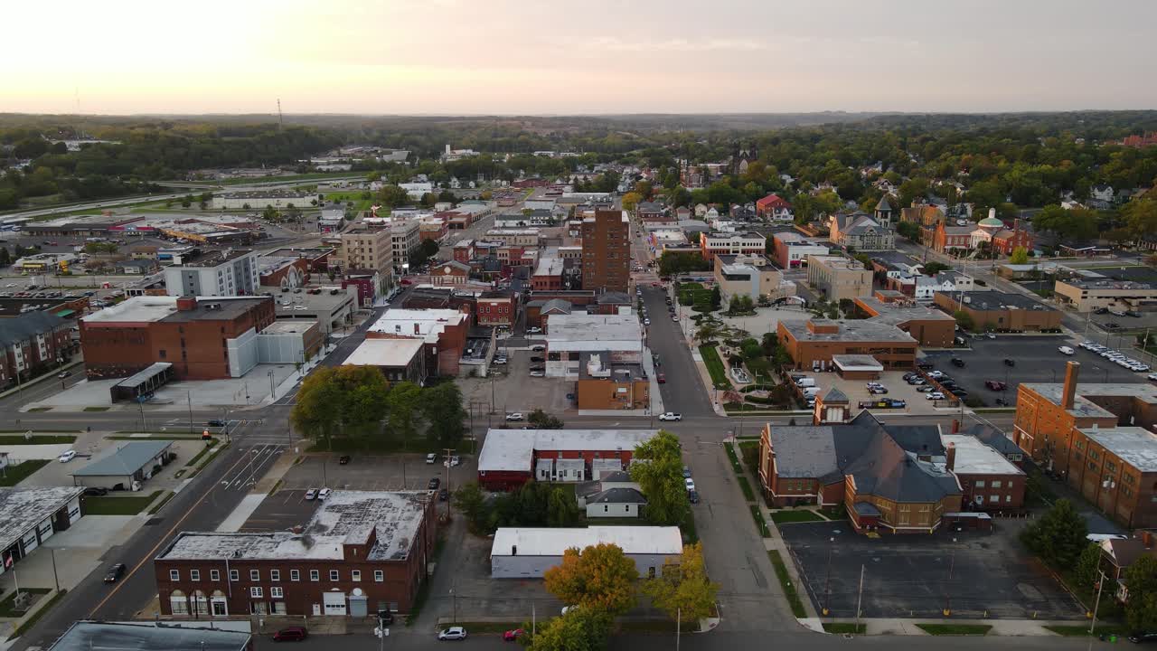Aerial view of downtown Massillon, Ohio at sunset featuring historic buildings and streets. Crane Up Sunset N