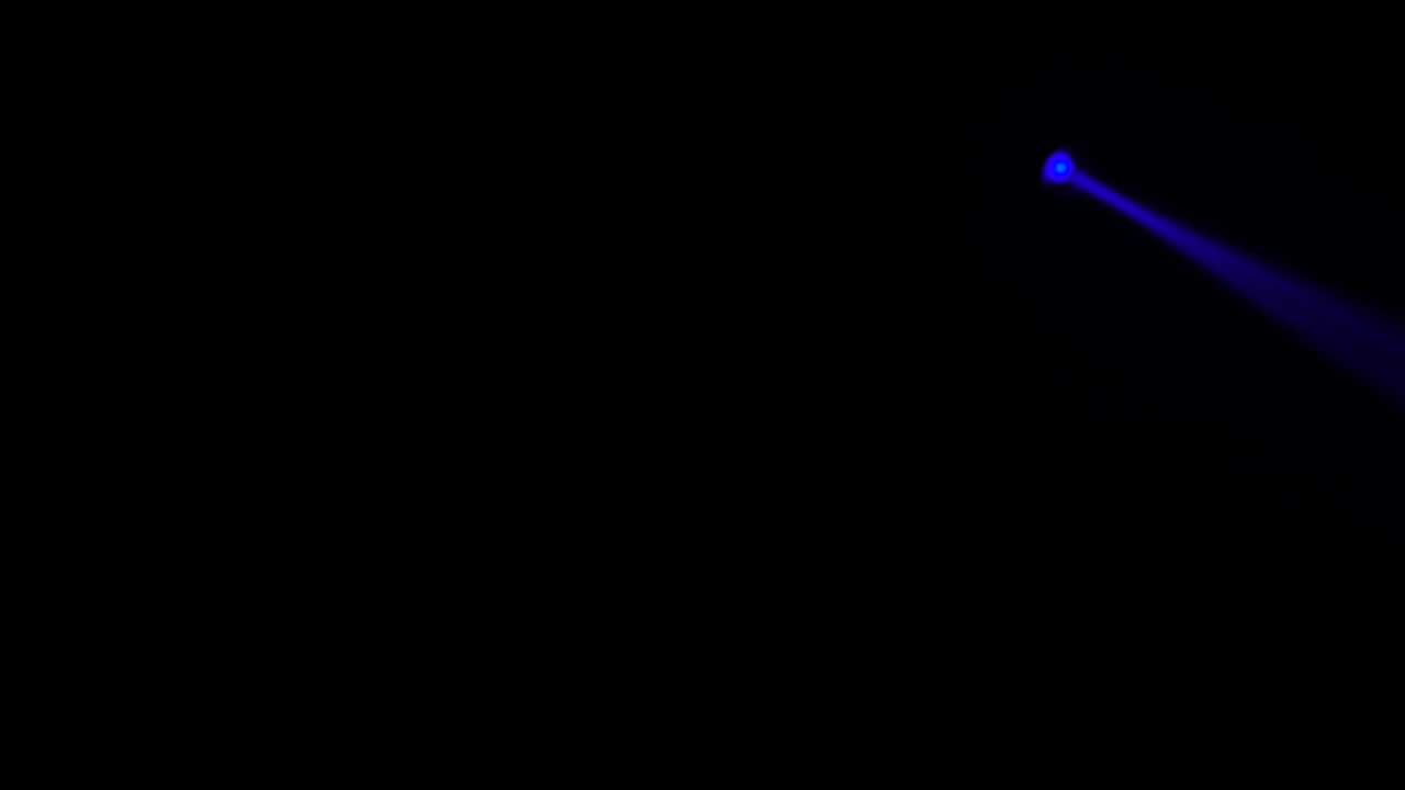 Rays of twirling multicolored lanterns on a black background