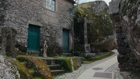 monsanto medieval village in portugal traditional street medium shot of a stone cross