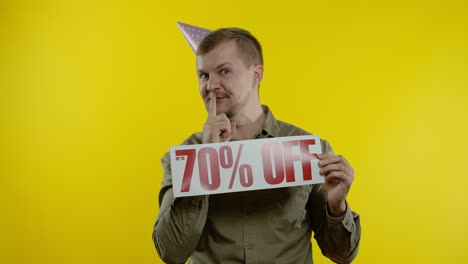 Amazed-store-client.-Man-showing-Up-To-70-Percent-Off-inscriptions-signs.-Black-Friday-concept