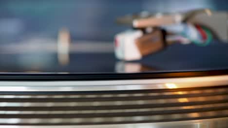 close up, modern turntable with rotating vinyl record, dj gear, equipment