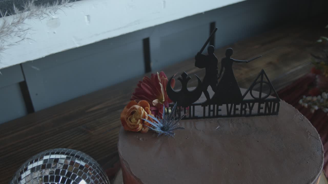 Star Wars and Harry Potter wedding cake topper for sci-fi fantasy loving fans