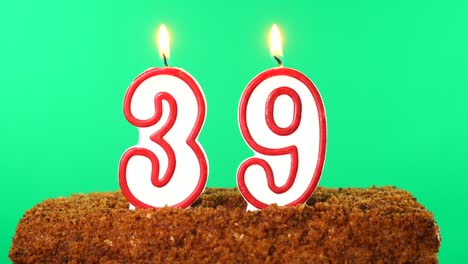 cake with the number 39 lighted candle. chroma key. green screen. isolated