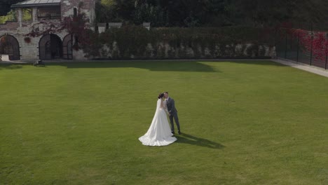 wedding couple walking in a garden