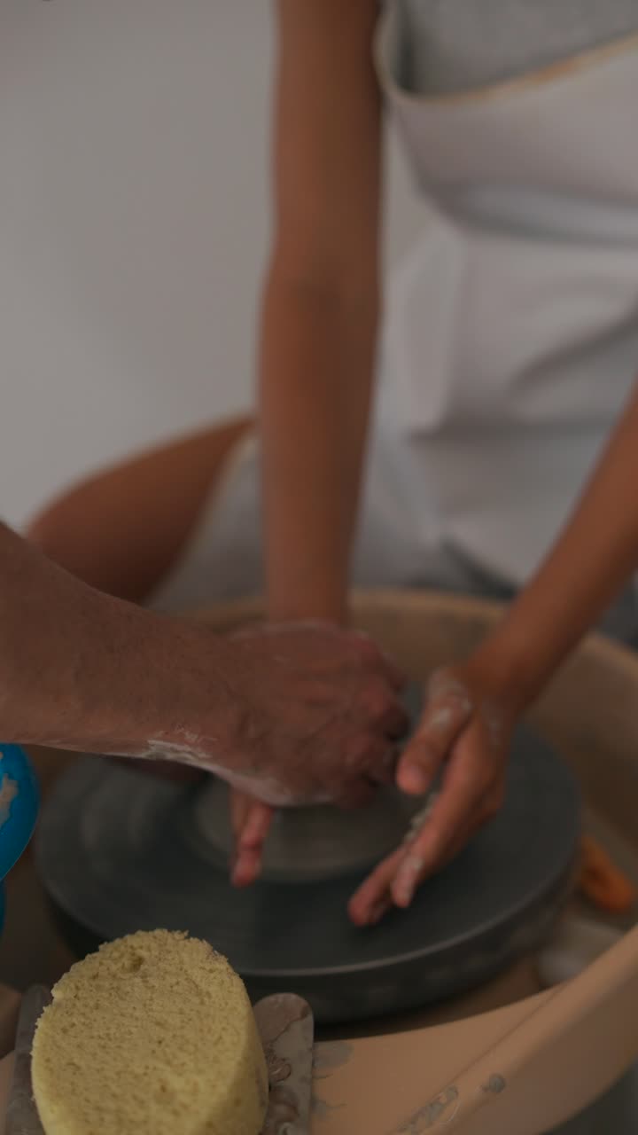 Learning Pottery: Hands-on Clay Shaping on a Wheel
