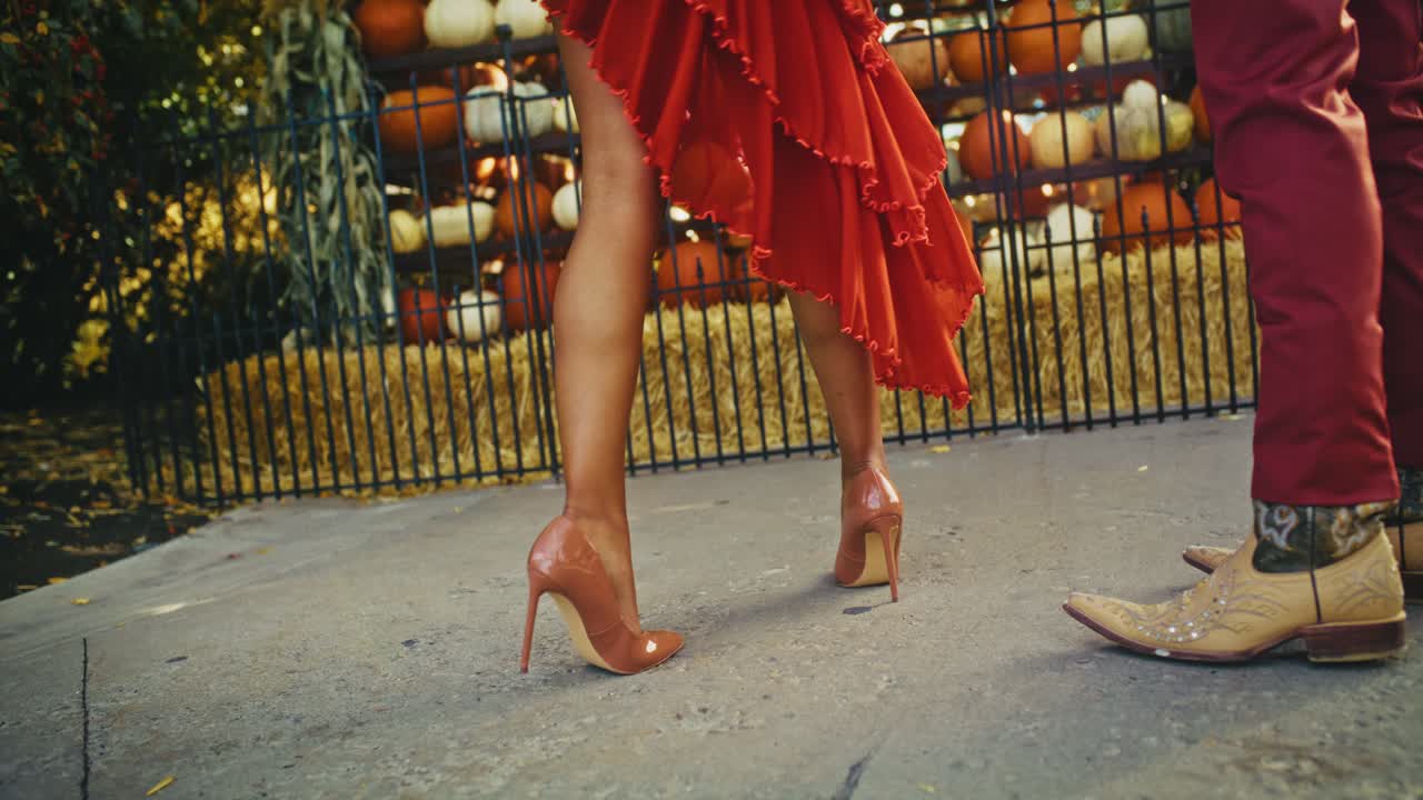 Couple Walking Through Pumpkin Patch