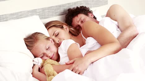 happy family sleeping together