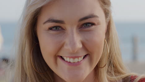 portrait beautiful blonde woman smiling outdoors at seaside happy lifestyle