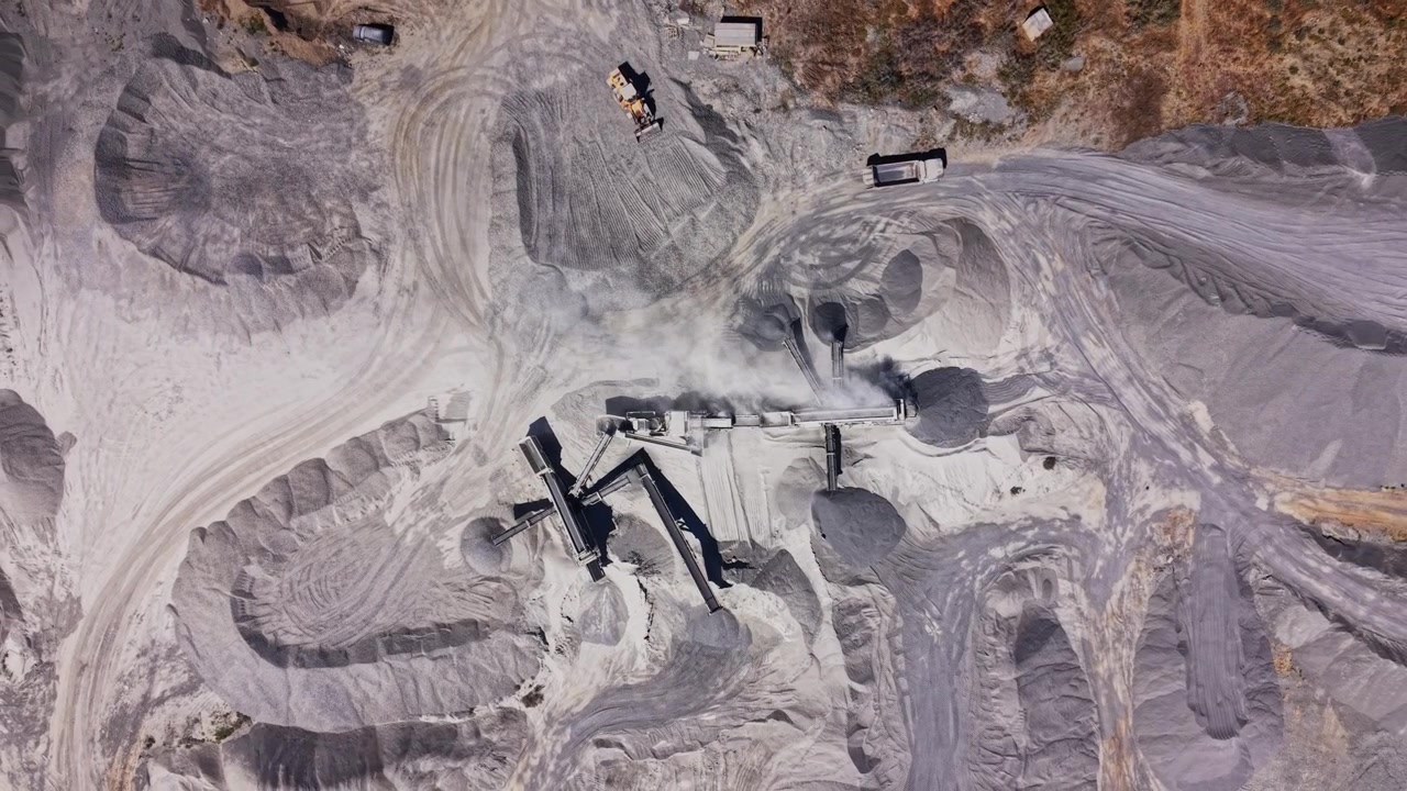 Construction site shows machinery working with gravel