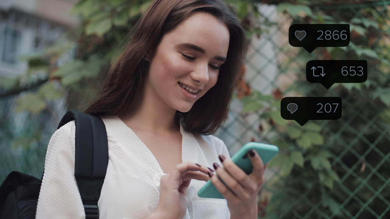 Young woman happily engaging with social media on her smartphone, showing real-time interaction metrics