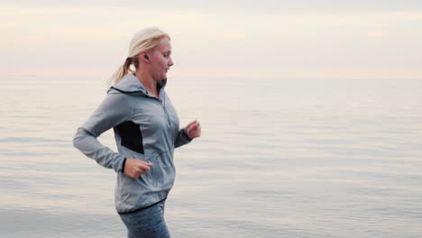 woman jogging along a shore