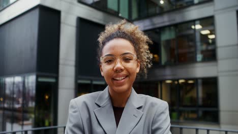 smiling young professional woman in city