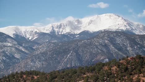 snow-covered pikes peak of the rocky mountains on sunny day in colorado, usa