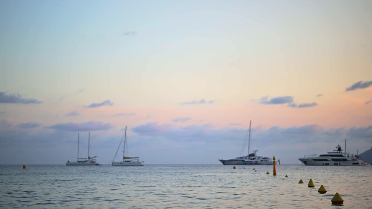 Mediterranean sea coast with yachts in Cannes at sunset, France