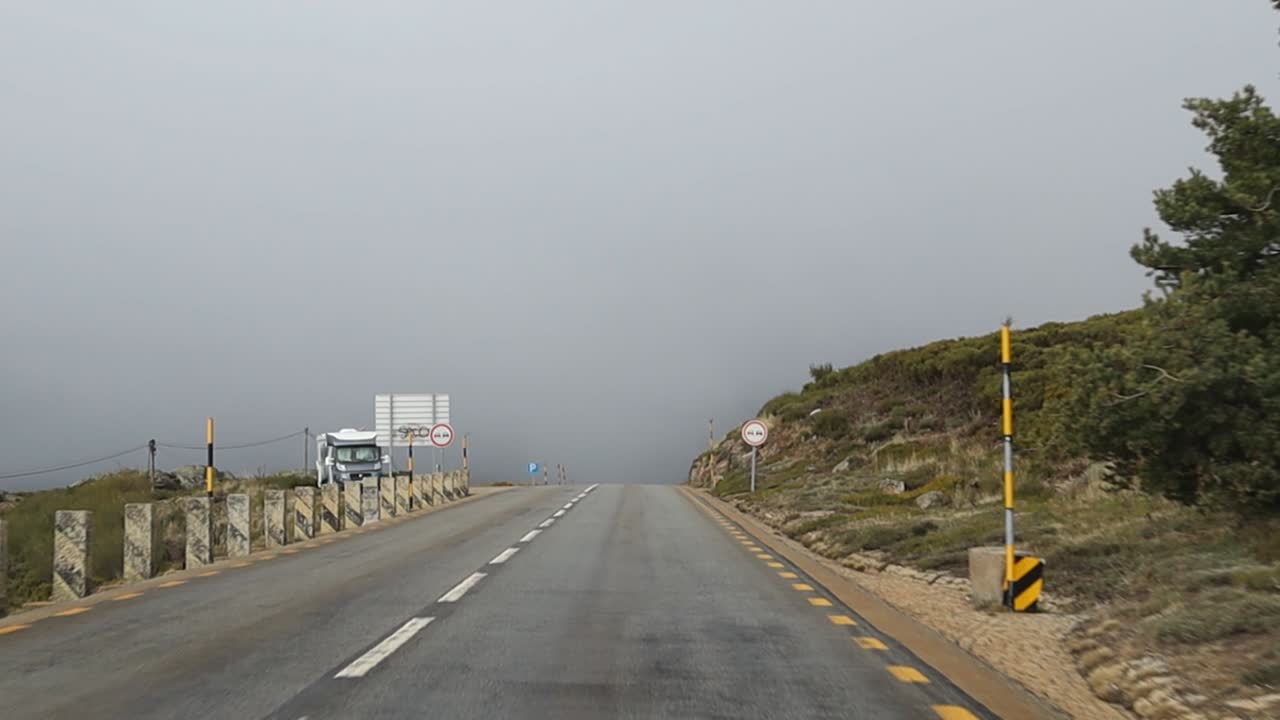 Driving on a European Road in the Serra da Estrela National Forest on a Cloudy Day