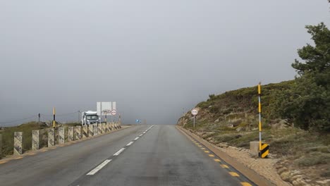 driving on a european road in the serra da estrela national forest on a cloudy day