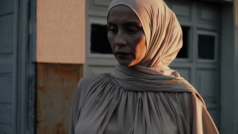 woman in hijab at sunset